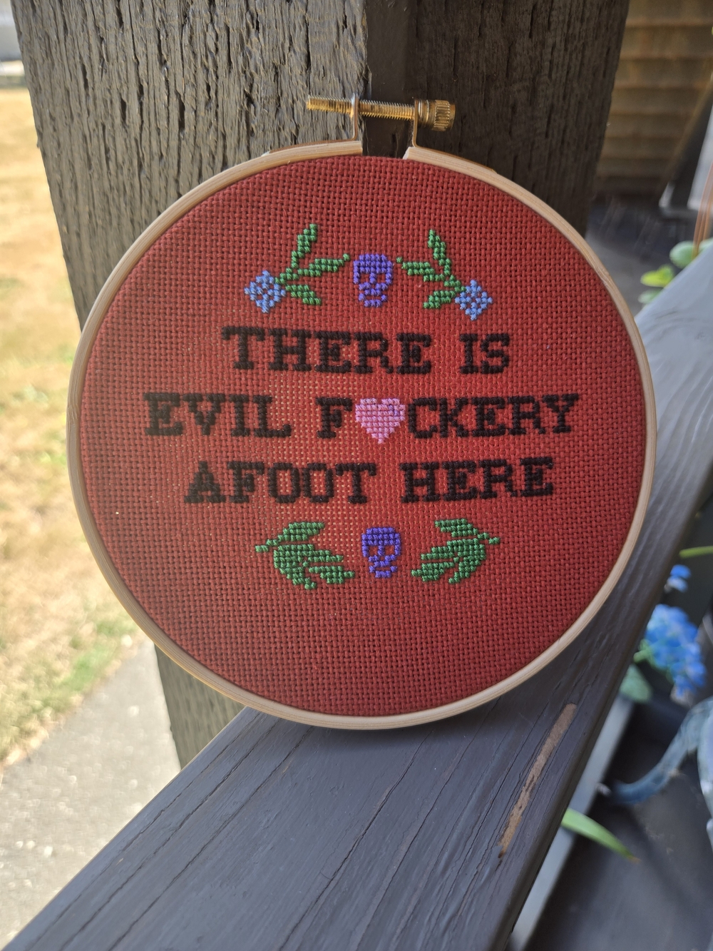 Handmade Red Cross-Stitch Hoop Wall Art with Playful Phrase